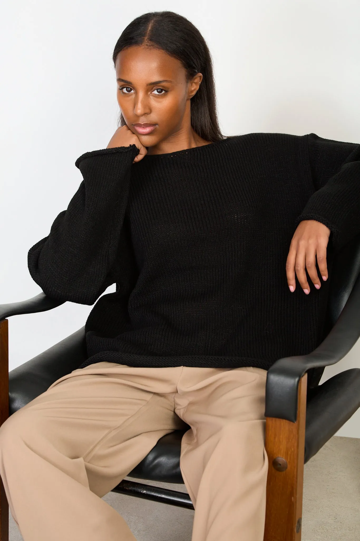 Black boat neck long roll hem jumper